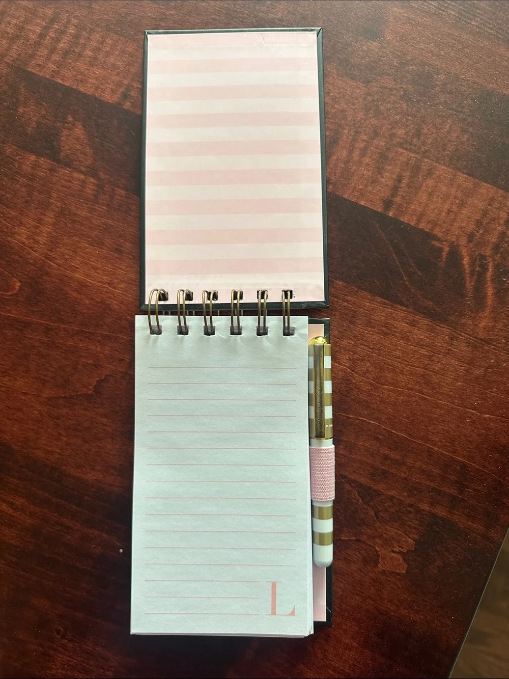 “L” spiral note pad with pen included